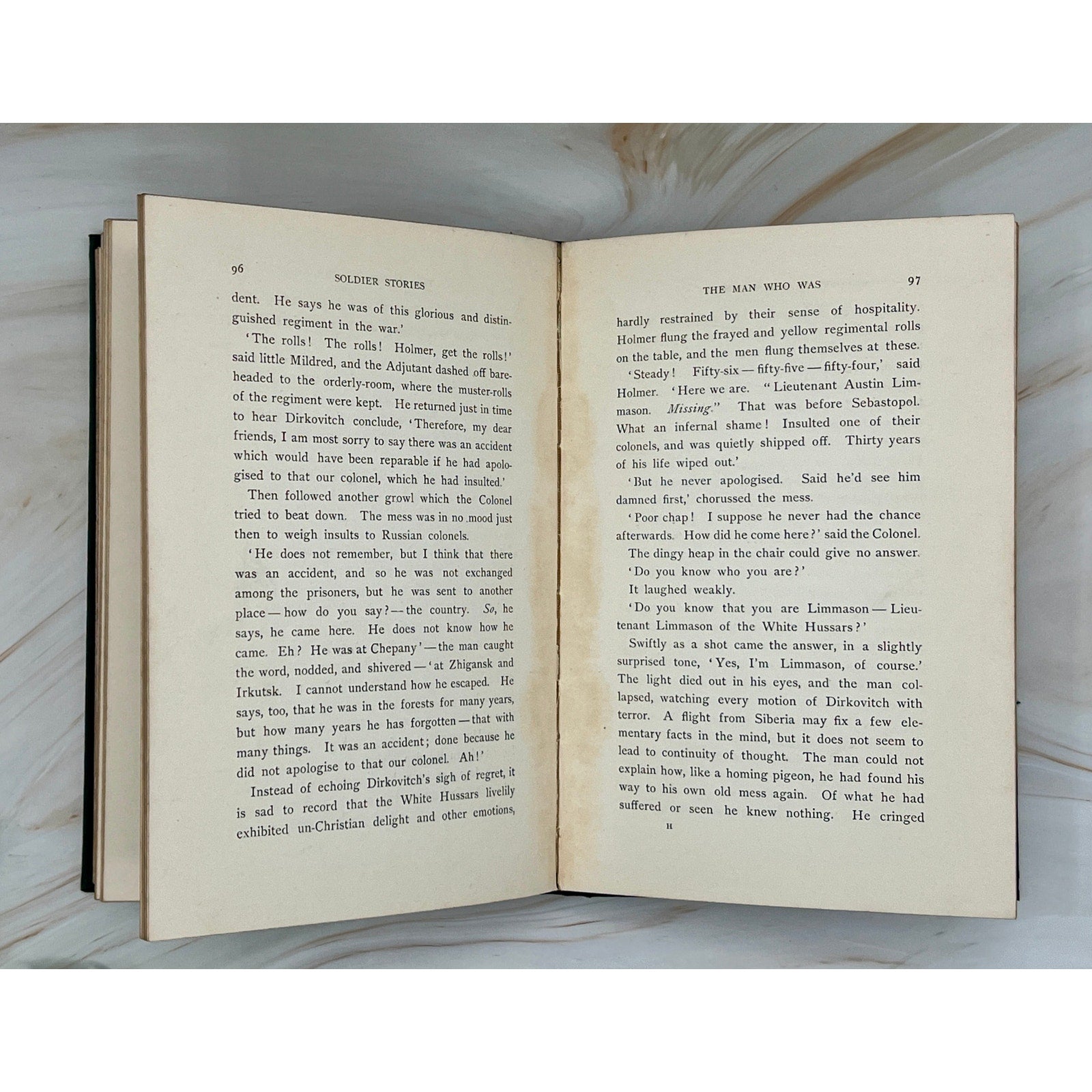 Antique 1897 Rudyard Kipling Soldier Stories hardcover with gilt-stamped soldiers and exotic wildlife on cover.