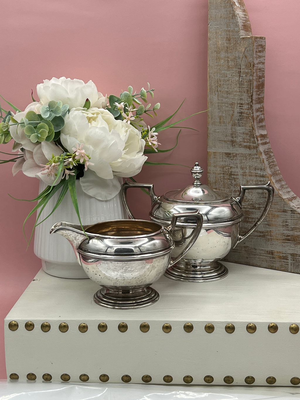 Antique William B. Durgin sterling silver two-handled covered sugar bowl with a polished urn-shaped body, stepped pedestal base, and matching domed lid topped with an urn finial displayed on a white tabletop. - Photo 5