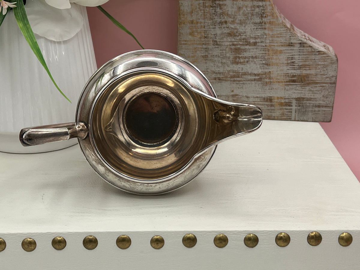 Antique William B. Durgin sterling silver two-handled covered sugar bowl with a polished urn-shaped body, stepped pedestal base, and matching domed lid topped with an urn finial displayed on a white tabletop. - Photo 8