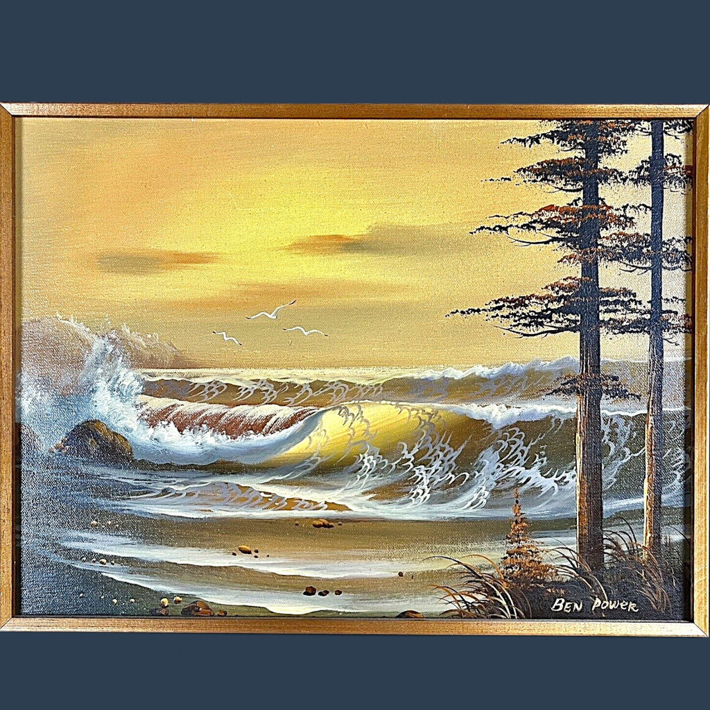 A vintage oil on canvas seascape painting depicting a sunset ocean with waves and coastal pine trees in the foreground, signed by artist Ben Power and housed in a deep wood frame with a black velvet mat. - Photo 2