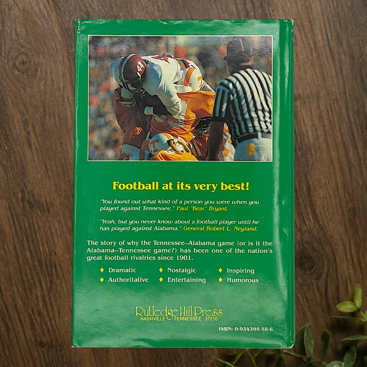 Hardcover book titled Third Saturday in October featuring a green dust jacket with bold white lettering and a full-color action illustration of Alabama and Tennessee football players in mid-tackle. - Photo 8