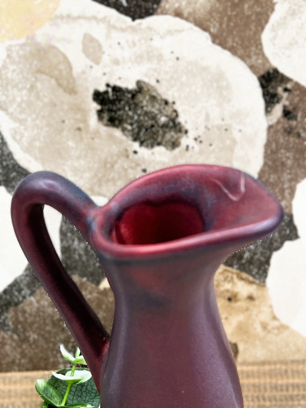 A vintage Van Briggle ceramic pitcher featuring a deep mulberry matte glaze with soft blue-tinted highlights along the pinched spout and sculpted arched handle. - Photo 4