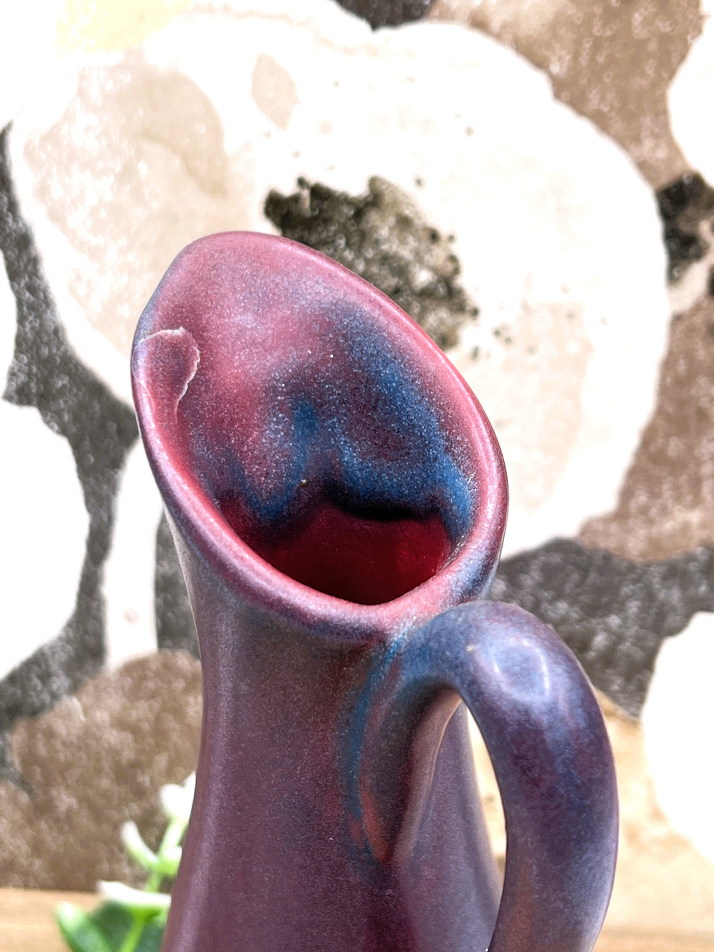 A vintage Van Briggle ceramic pitcher featuring a deep mulberry matte glaze with soft blue-tinted highlights along the pinched spout and sculpted arched handle. - Photo 5