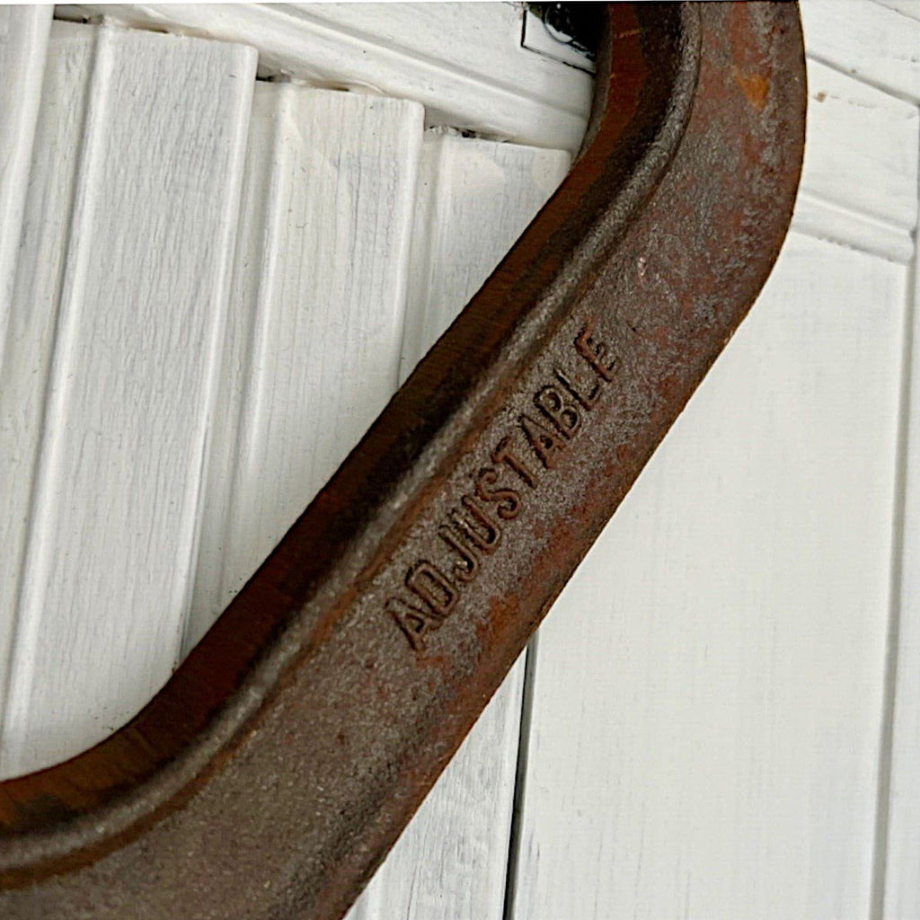 A pair of vintage industrial cast iron C-clamps by the Adjustable Clamp Co. displaying a rich rust brown patina on their heavy frames and steel screws. - Photo 7