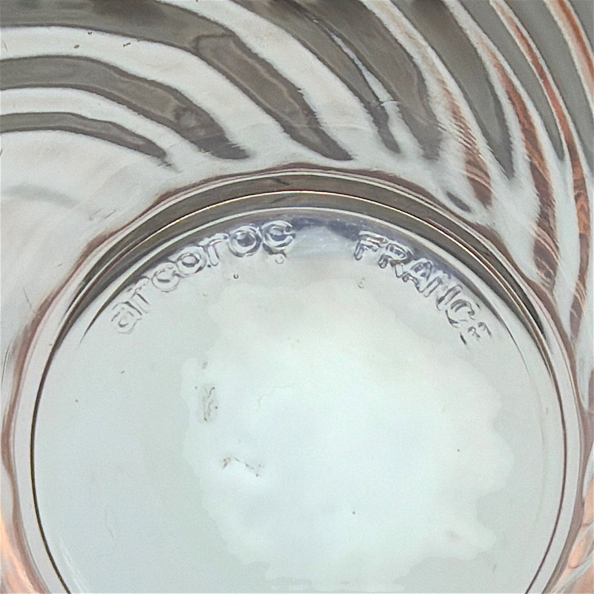 A pair of vintage Arcoroc Rosaline blush pink glass tumblers featuring a diagonal spiral swirl optic texture, displayed side by side on a weathered wooden surface in front of white louvered shutters. - Photo 3