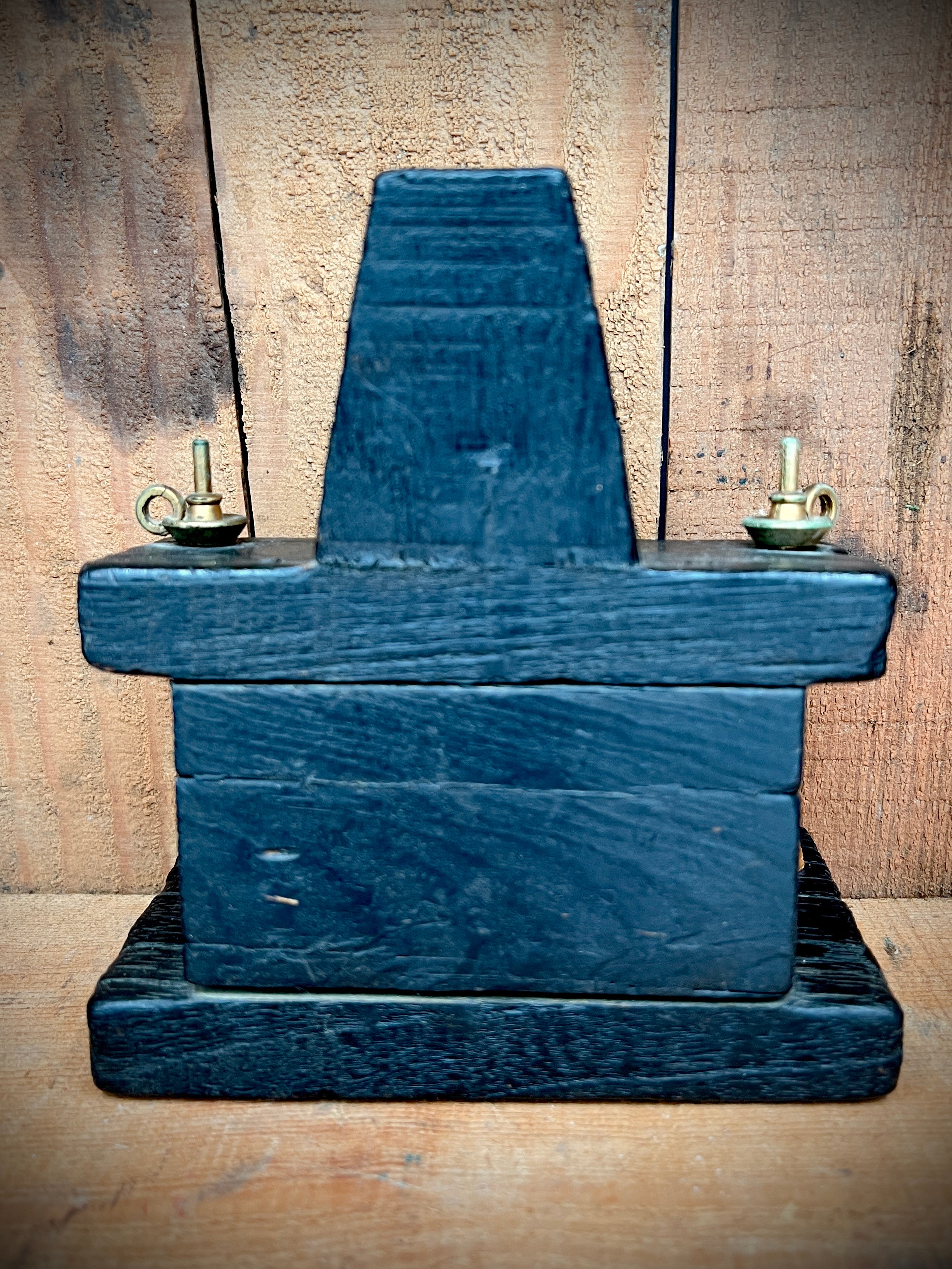 A vintage miniature fireplace hearth crafted from dark wood, showcasing tiny split logs and a gold-colored brass cauldron pot with a thin metal handle. - Photo 4
