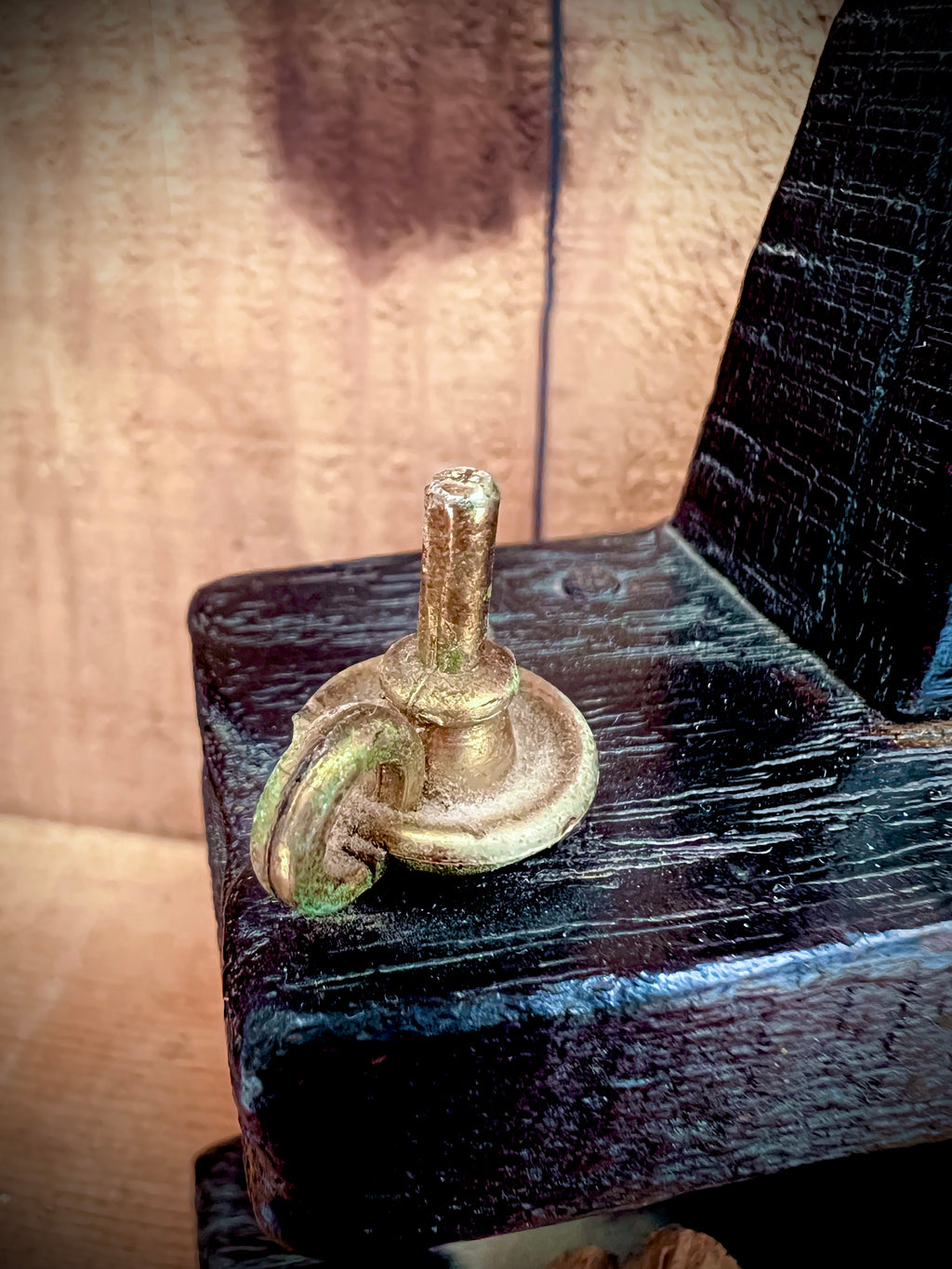 A vintage miniature fireplace hearth crafted from dark wood, showcasing tiny split logs and a gold-colored brass cauldron pot with a thin metal handle. - Photo 6