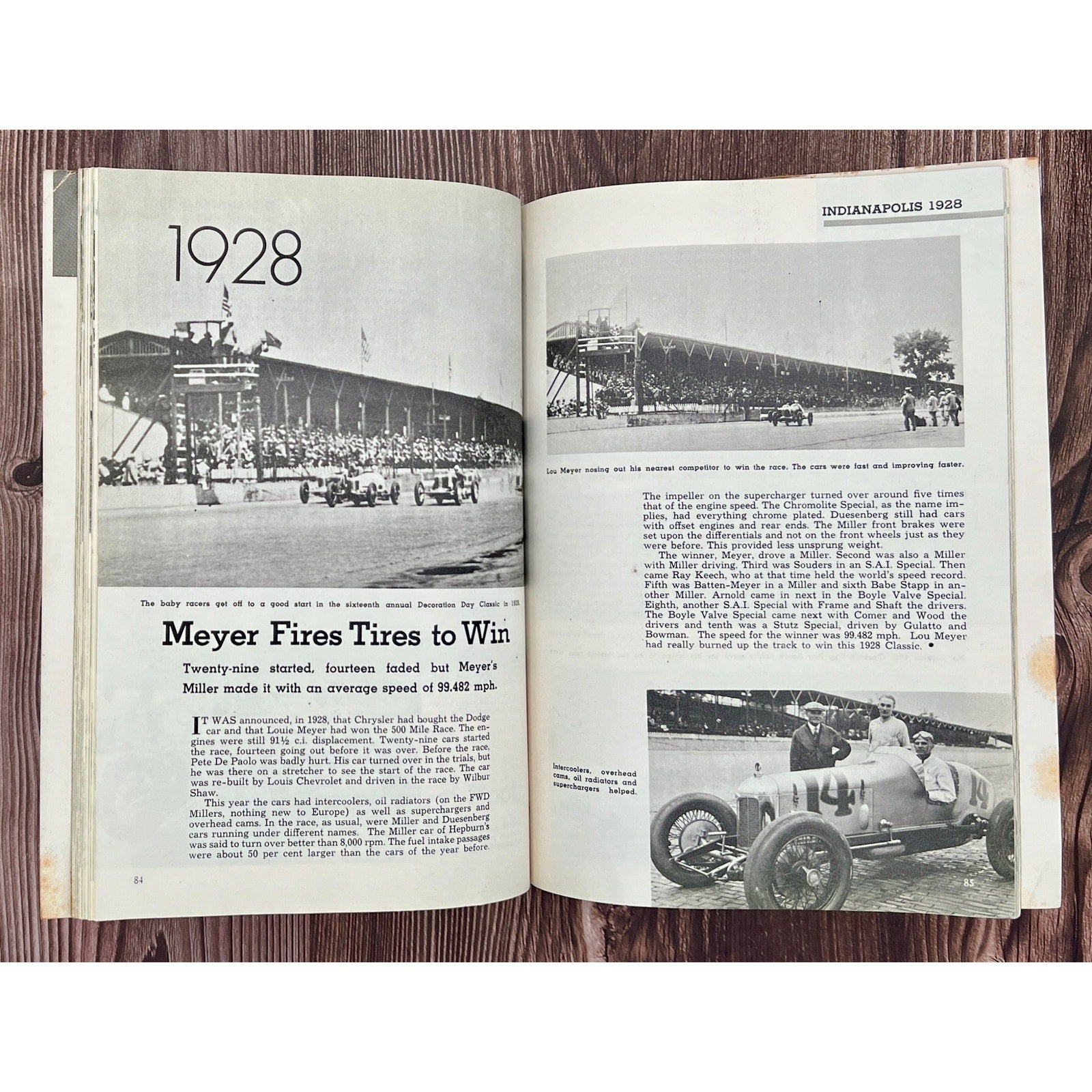 Open book showing pages about 1928 Indianapolis 500 race with black and white photos and text.