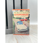 Book titled 'The Observer's Book of Automobiles' on a white surface with a gray background