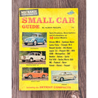 Book cover of 'Mechanix Illustrated Small Car Guide' on a wooden surface