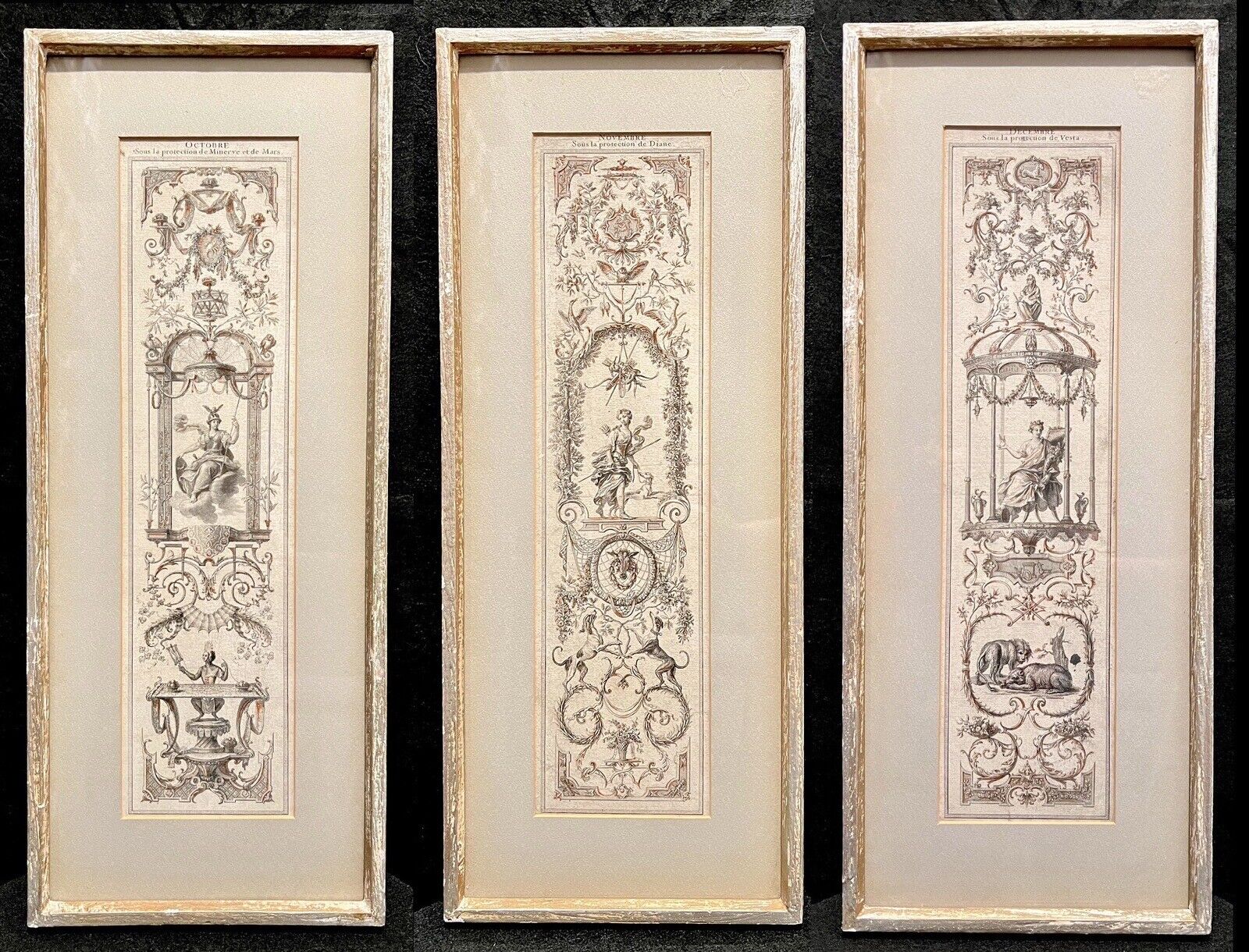 A set of three vertically framed French Baroque style art prints by Claude Audran, featuring intricate sepia-toned tapestry designs with classical architecture and animals. - Photo 1