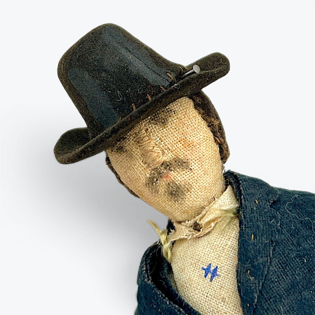 A vintage German miniature bendable dollhouse doll depicting a man in a traditional black suit and wide-brimmed black hat. - Photo 5