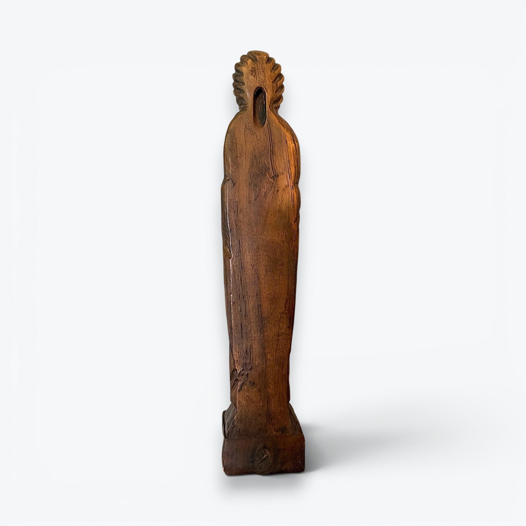 A rustic, hand-carved wooden religious saint figurine standing on a pegged base, featuring intricate carved details of robes, a beard, and symbolic items. - Photo 4