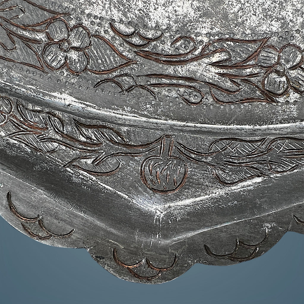 An octagonal tinned copper tray featuring intricate hand-chased Persian floral scrollwork, an elaborate eight-pointed star medallion, and a scalloped rim. - Photo 6