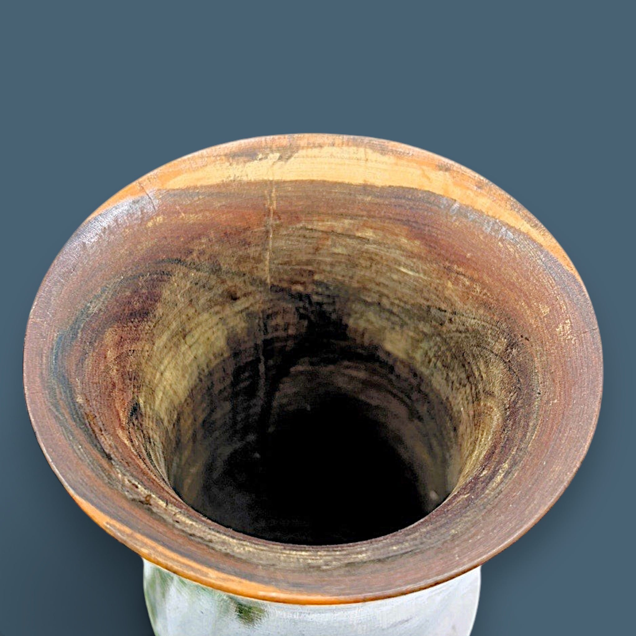 A vintage hand-turned wood chalice vase with a flared rim and a stout pedestal base, displaying a highly figured grain with rich brown and golden hues and fine concentric incised lines around the body against a solid dark grey background. - Photo 2