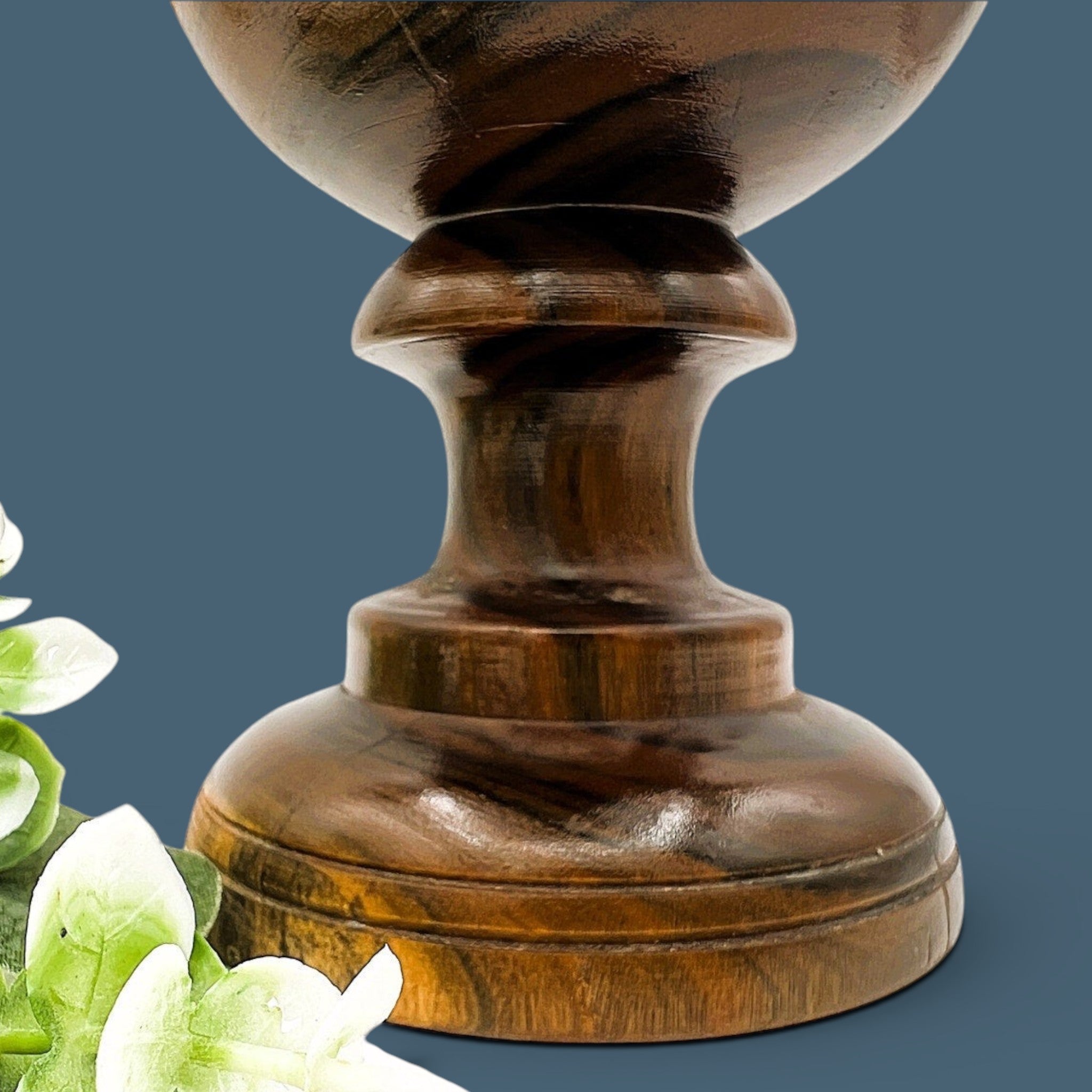A vintage hand-turned wood chalice vase with a flared rim and a stout pedestal base, displaying a highly figured grain with rich brown and golden hues and fine concentric incised lines around the body against a solid dark grey background. - Photo 3