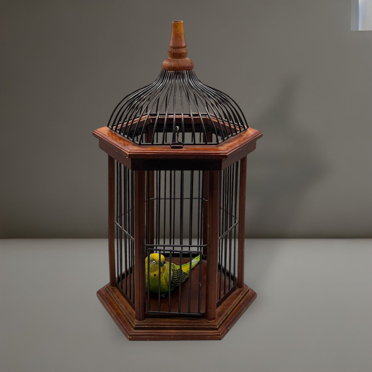 Hexagonal wood and wire decorative birdcage with a dark wooden frame, thin vertical metal bars, and a hinged wire top lid held open. - Photo 1