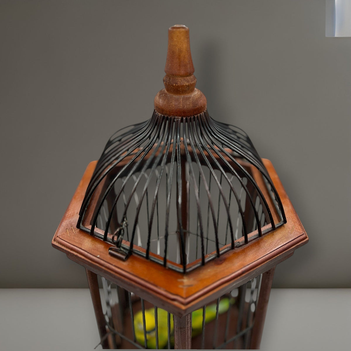 Hexagonal wood and wire decorative birdcage with a dark wooden frame, thin vertical metal bars, and a hinged wire top lid held open. - Photo 6
