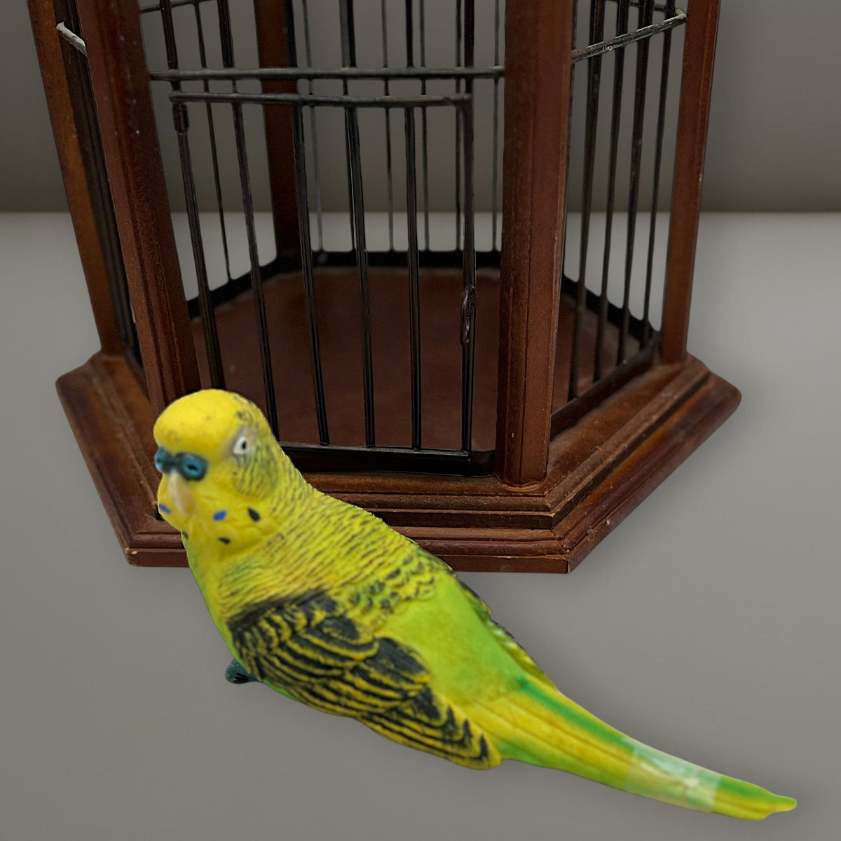 Hexagonal wood and wire decorative birdcage with a dark wooden frame, thin vertical metal bars, and a hinged wire top lid held open. - Photo 8