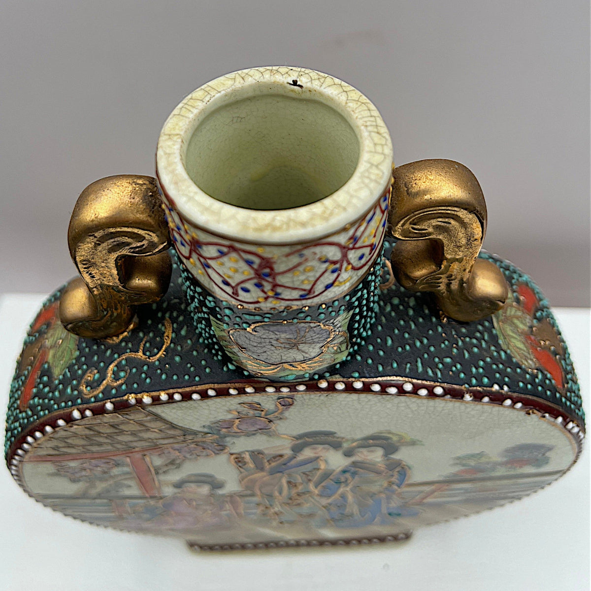 Japanese Satsuma ceramic moon flask vase with gilded scroll handles, fine cream crackle glaze, and hand-painted geisha figures in colorful kimonos surrounded by raised moriage enamel beading along the shoulders and borders. - Photo 6