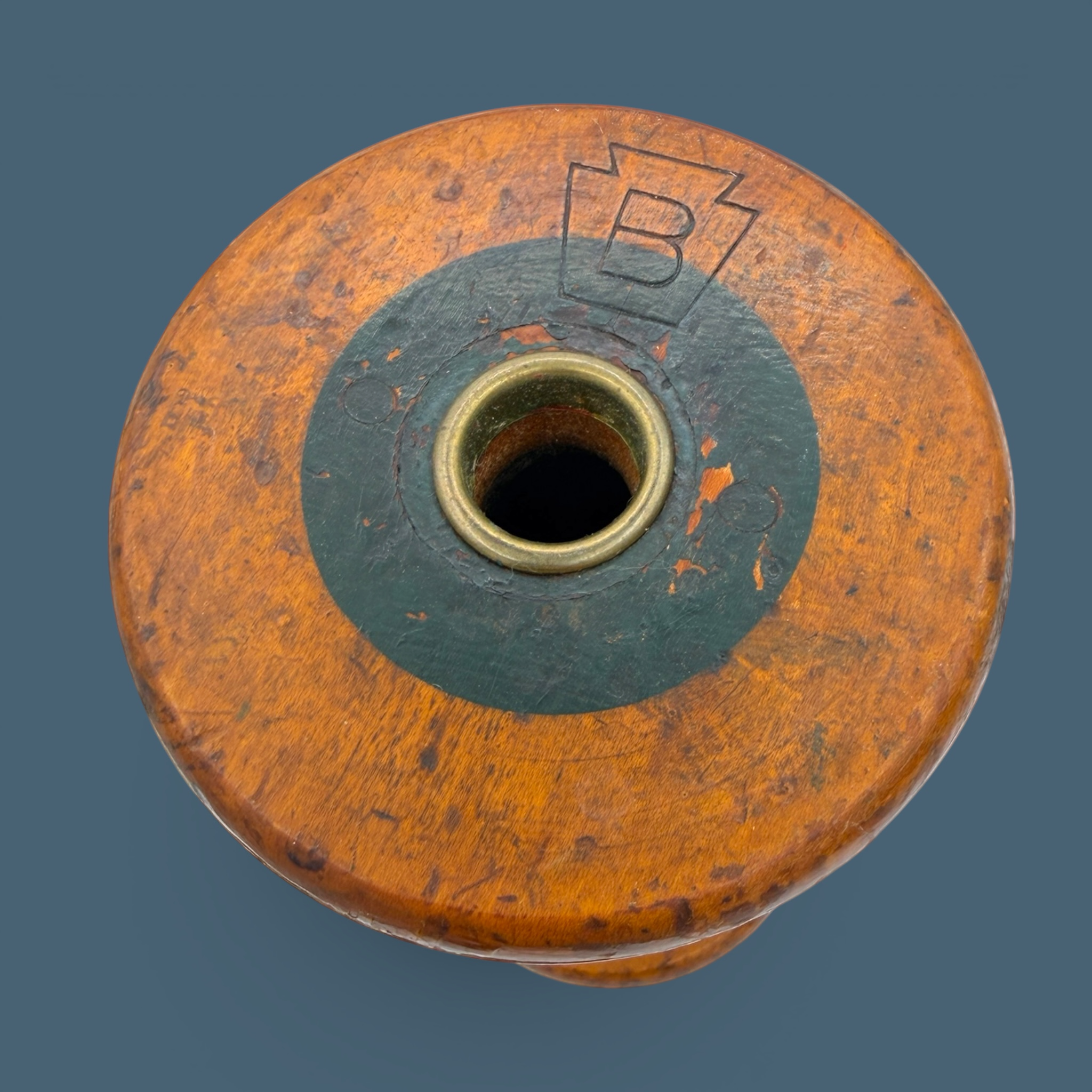 An antique wooden industrial bobbin with a rich brown finish, a thick central spindle, and two wide circular flanges at the top and bottom. - Photo 5