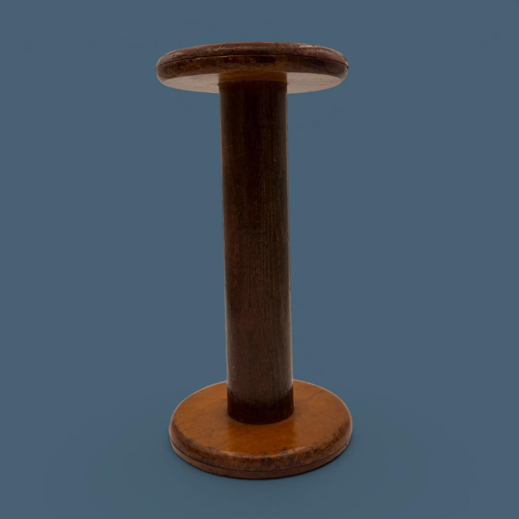 An antique wooden industrial bobbin with a rich brown finish, a thick central spindle, and two wide circular flanges at the top and bottom. - Photo 6