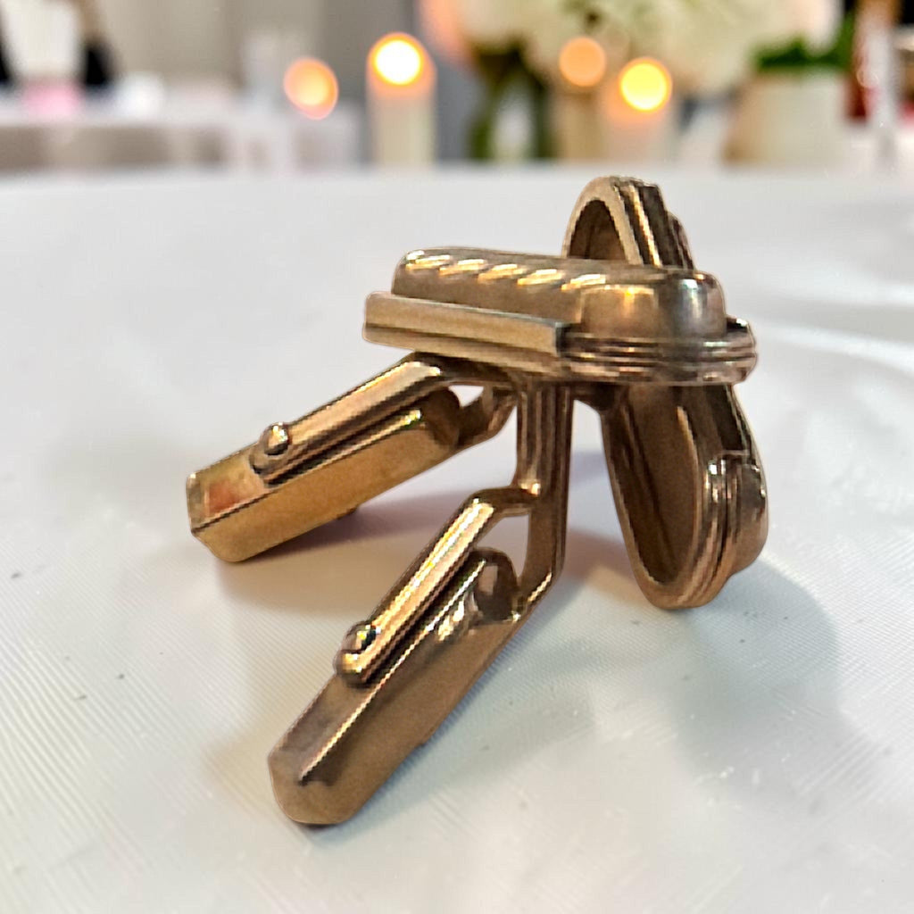 Pair of gold-tone rectangular cufflinks with a diagonal ribbed pattern and swivel toggle back closures. - Photo 3