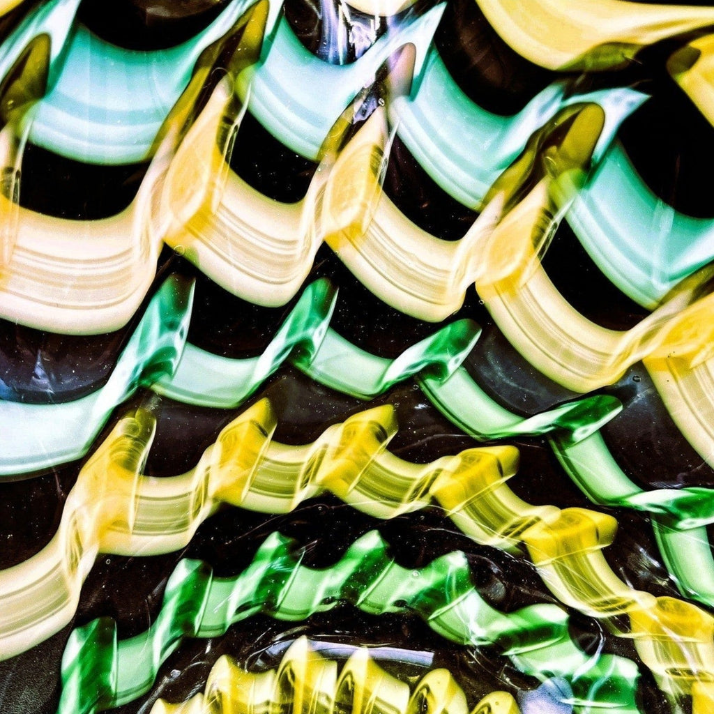 A hand-blown Murano glass handkerchief vase displaying spiraling vertical ribbons of emerald green, canary yellow, and white latticino filigree. - Photo 5