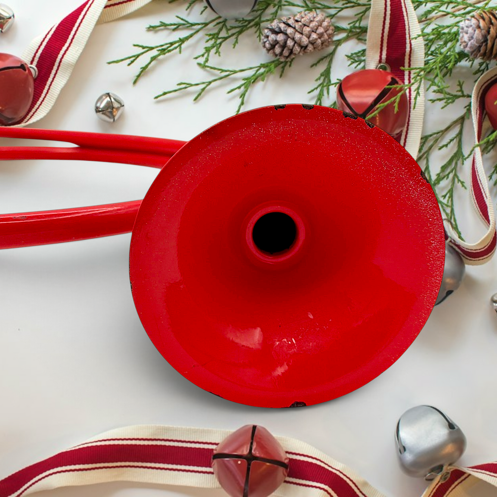Vintage red painted metal circular hunting horn with flared bell and mouthpiece against a white background - Photo 7