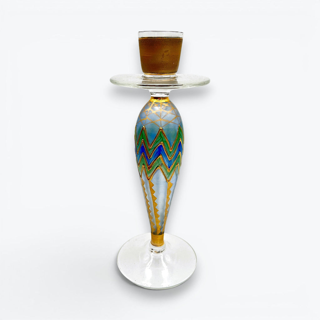 Hand-painted glass candlestick by Paul Nagel featuring cobalt blue and emerald green chevron patterns accented by metallic gold grids on a frosted body. - Photo 1