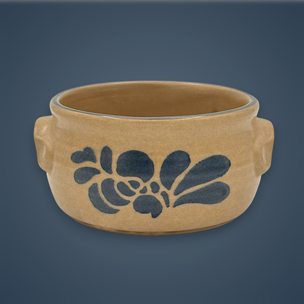 Pfaltzgraff tan stoneware onion soup bowl with molded side lug handles, a rolled top rim accented by a dark blue band, and a smooth buff ceramic finish. - Photo 1