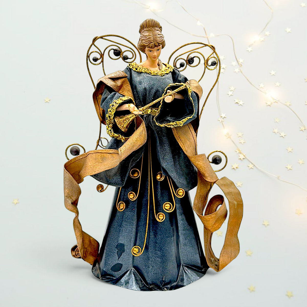 Full front view of a vintage mixed metal and fabric Christmas angel tree topper with horn and wire wings - Photo 1