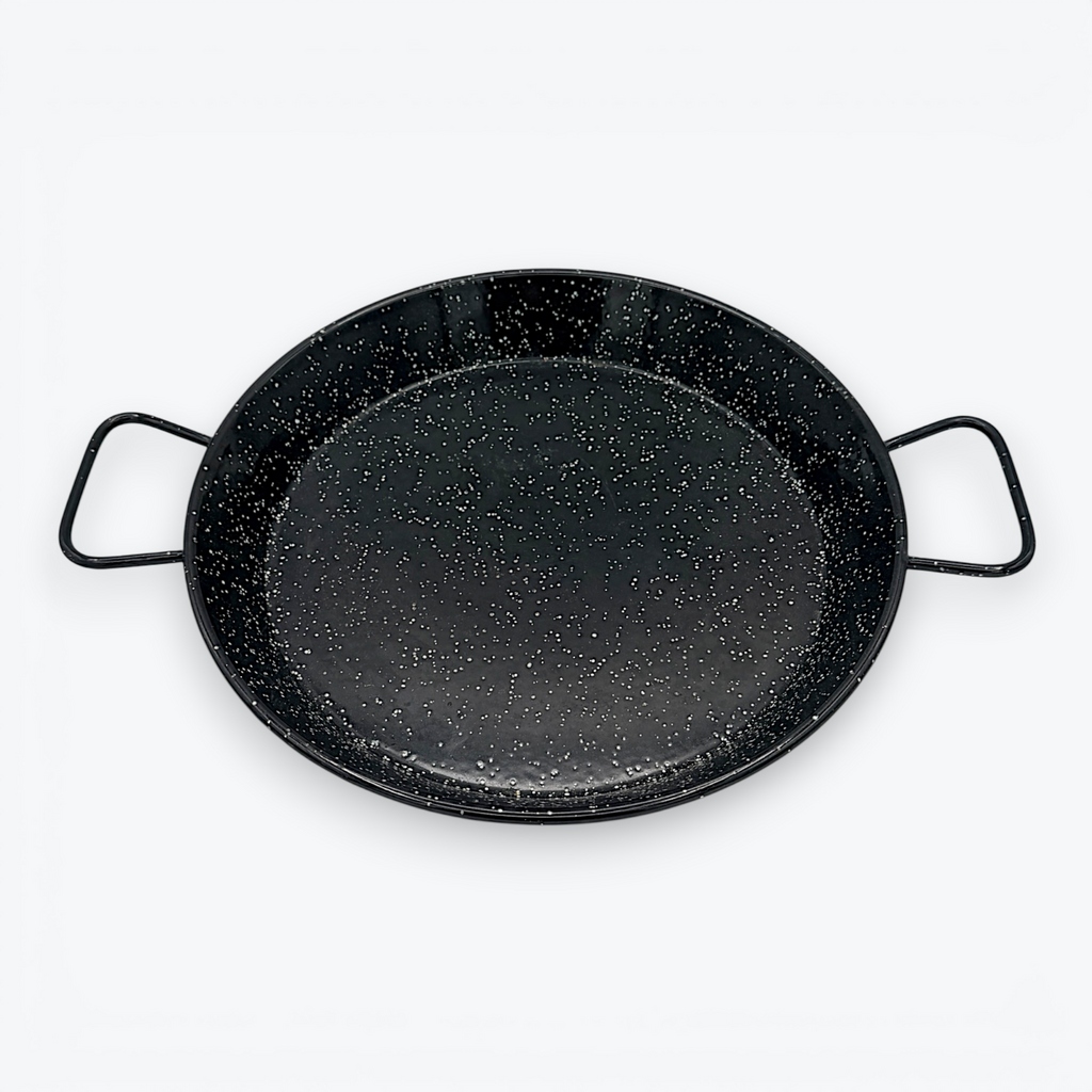 A round, shallow black enamelware paella pan with a white speckled pattern and two wire handles on opposite sides, displayed against a clean white background. - Photo 3