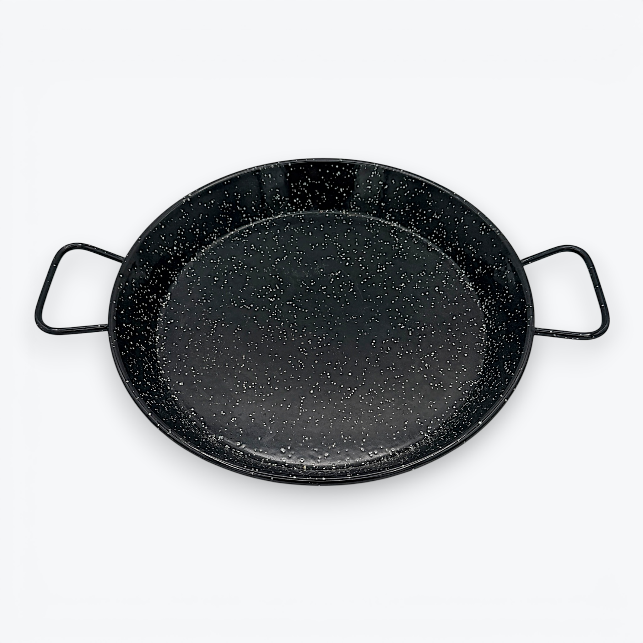 A round, shallow black enamelware paella pan with a white speckled pattern and two wire handles on opposite sides, displayed against a clean white background. - Photo 3