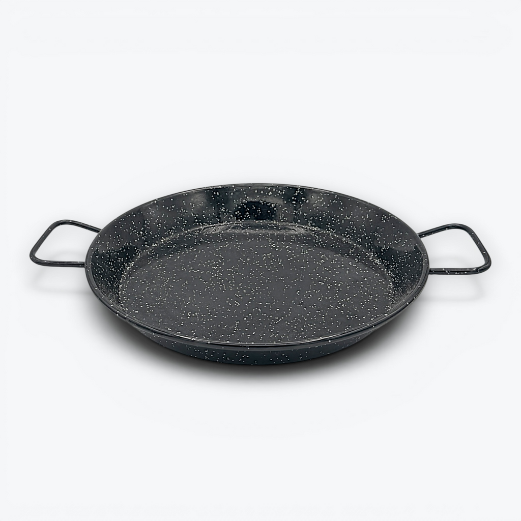 A round, shallow black enamelware paella pan with a white speckled pattern and two wire handles on opposite sides, displayed against a clean white background. - Photo 4