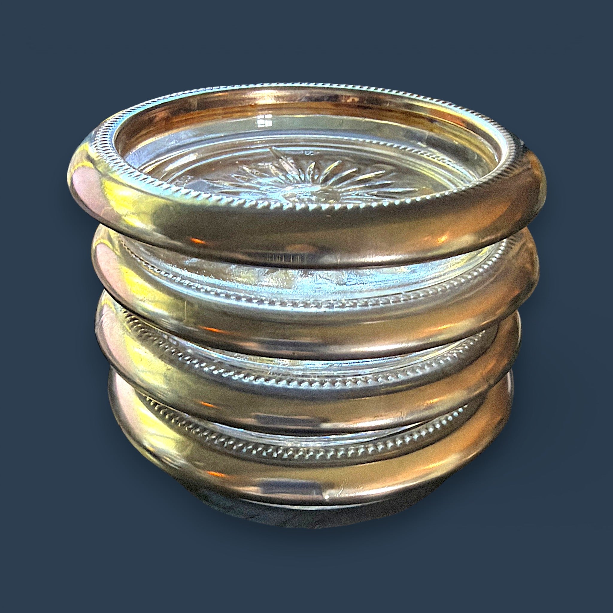 Set of four stacked vintage glass coasters with polished silverplated beaded rims and a clear starburst patterned center. - Photo 6