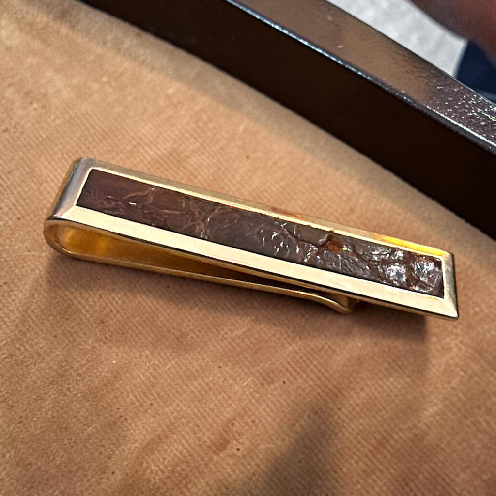 Vintage Swank rectangular gold-tone tie bar clip featuring a dark brown textured leather inlay. - Photo 1