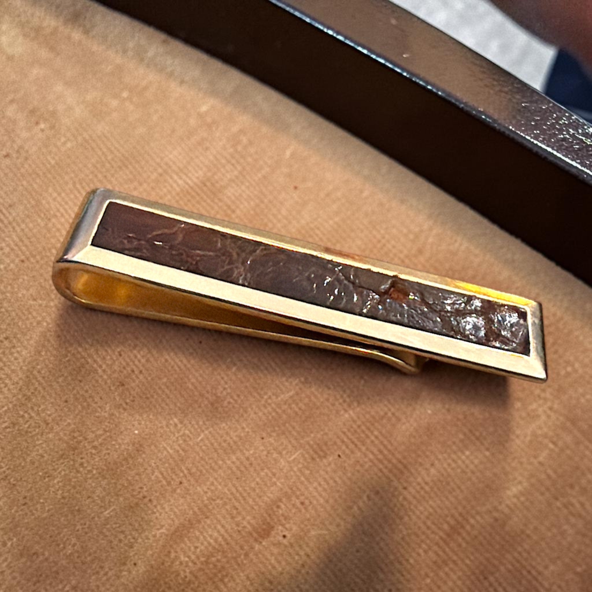 Vintage Swank rectangular gold-tone tie bar clip featuring a dark brown textured leather inlay. - Photo 1