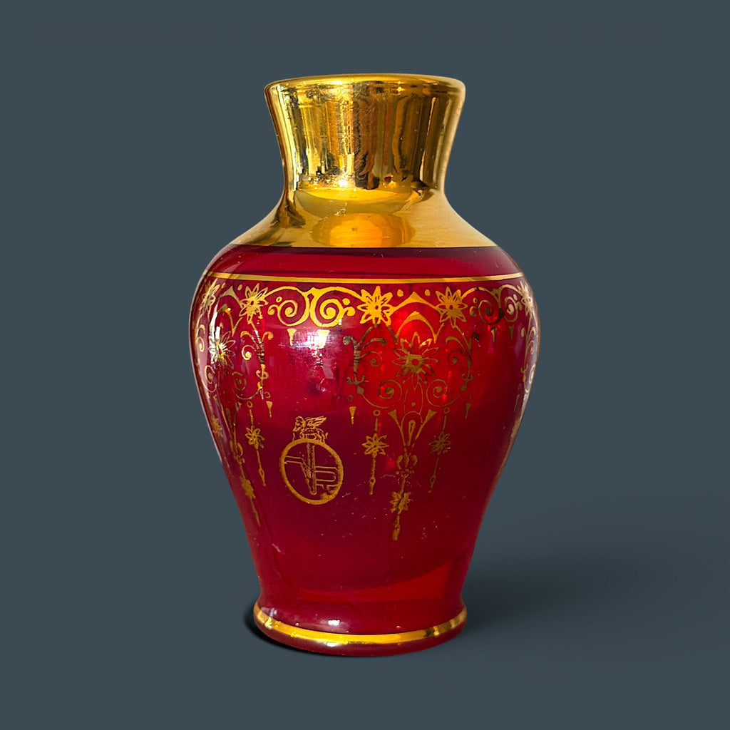 A vintage Italian Murano ruby red glass miniature vase decorated with detailed 24-karat gold gilt floral scrollwork and the winged Lion of Saint Mark emblem. - Photo 1