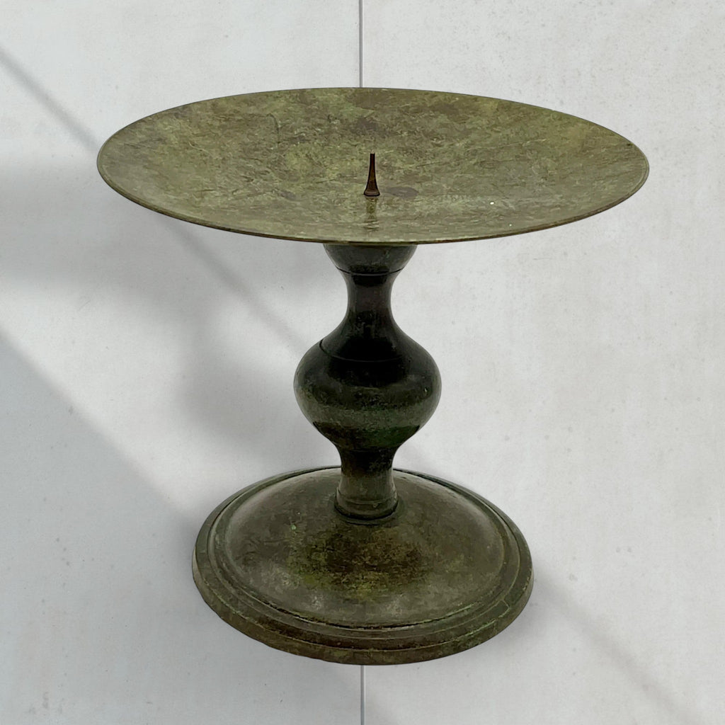 Vintage green verdigris patinated bronze pricket candlestick holder with a wide dished drip pan, central candle spike, and turned baluster stem resting on a circular stepped base. - Photo 3