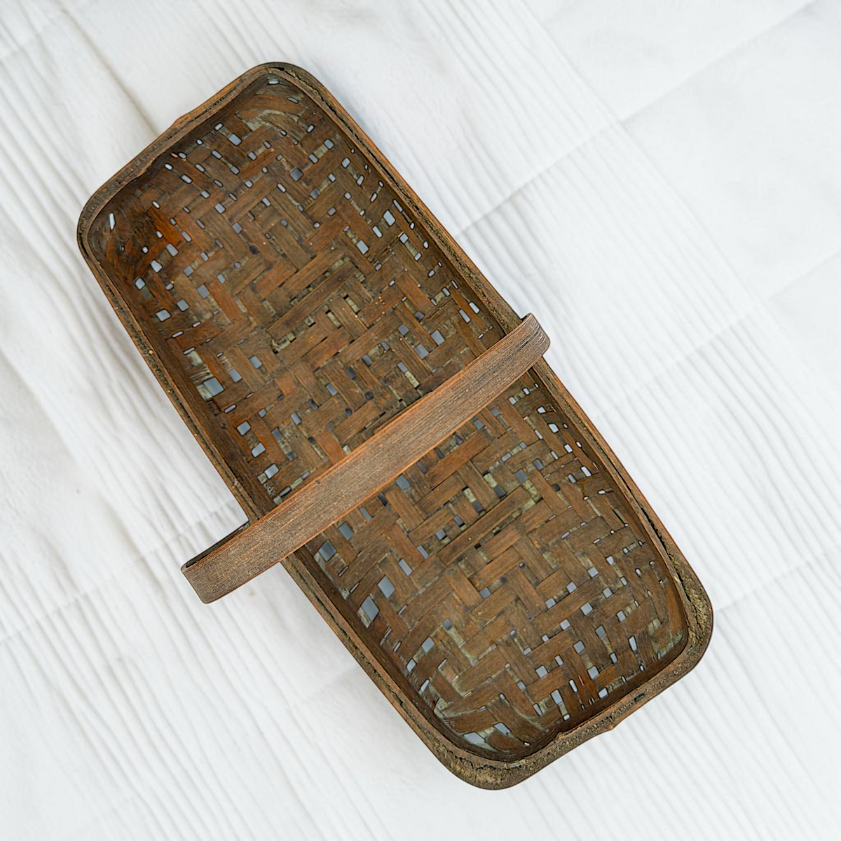 Shallow rectangular vintage wood splint gathering basket with an arched bentwood handle and open weave base resting on a white surface. - Photo 3