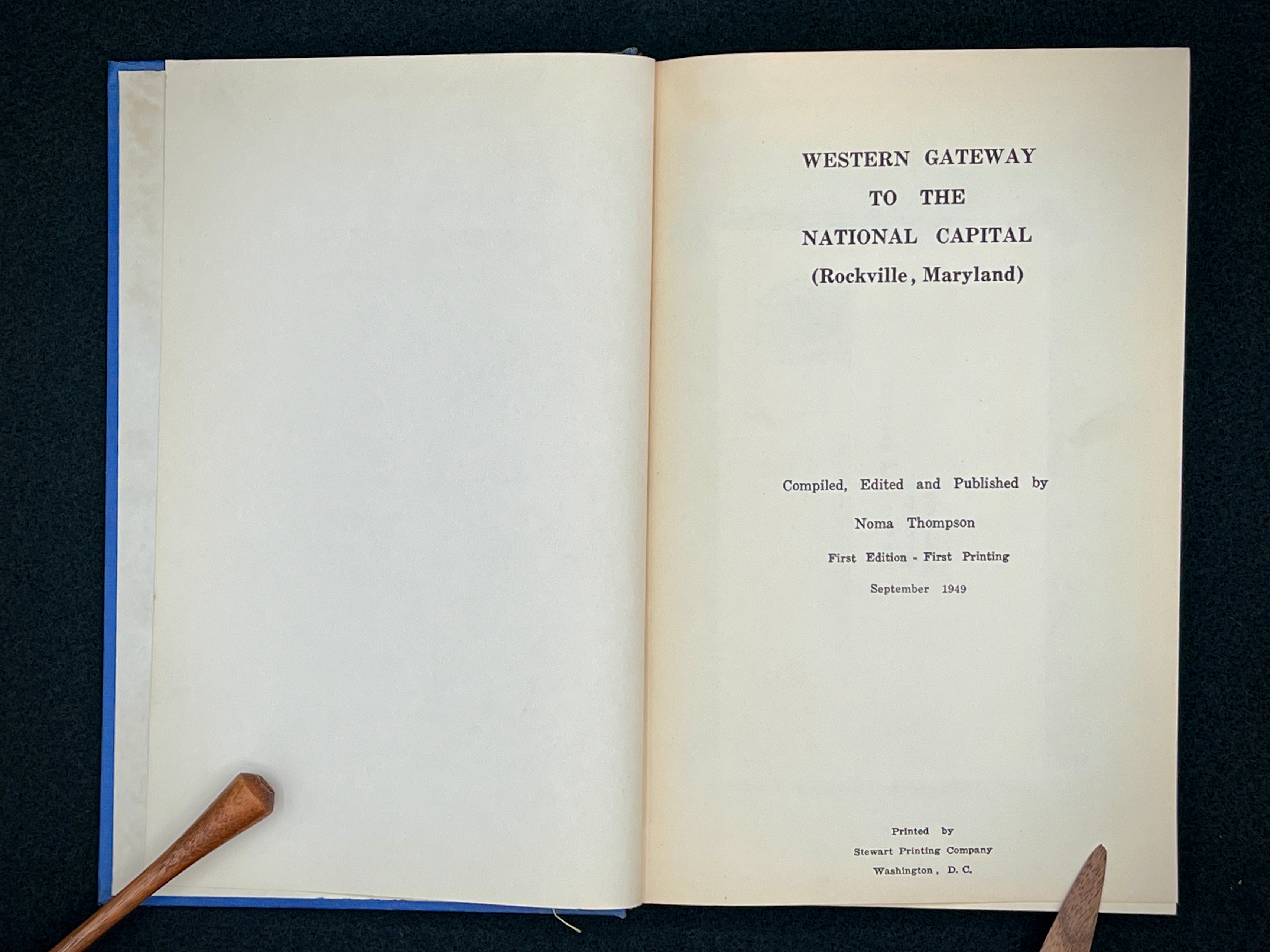 A light blue vintage paper cover of a mid-century Montgomery County Maryland historical publication resting flat on a dark background. - Photo 4