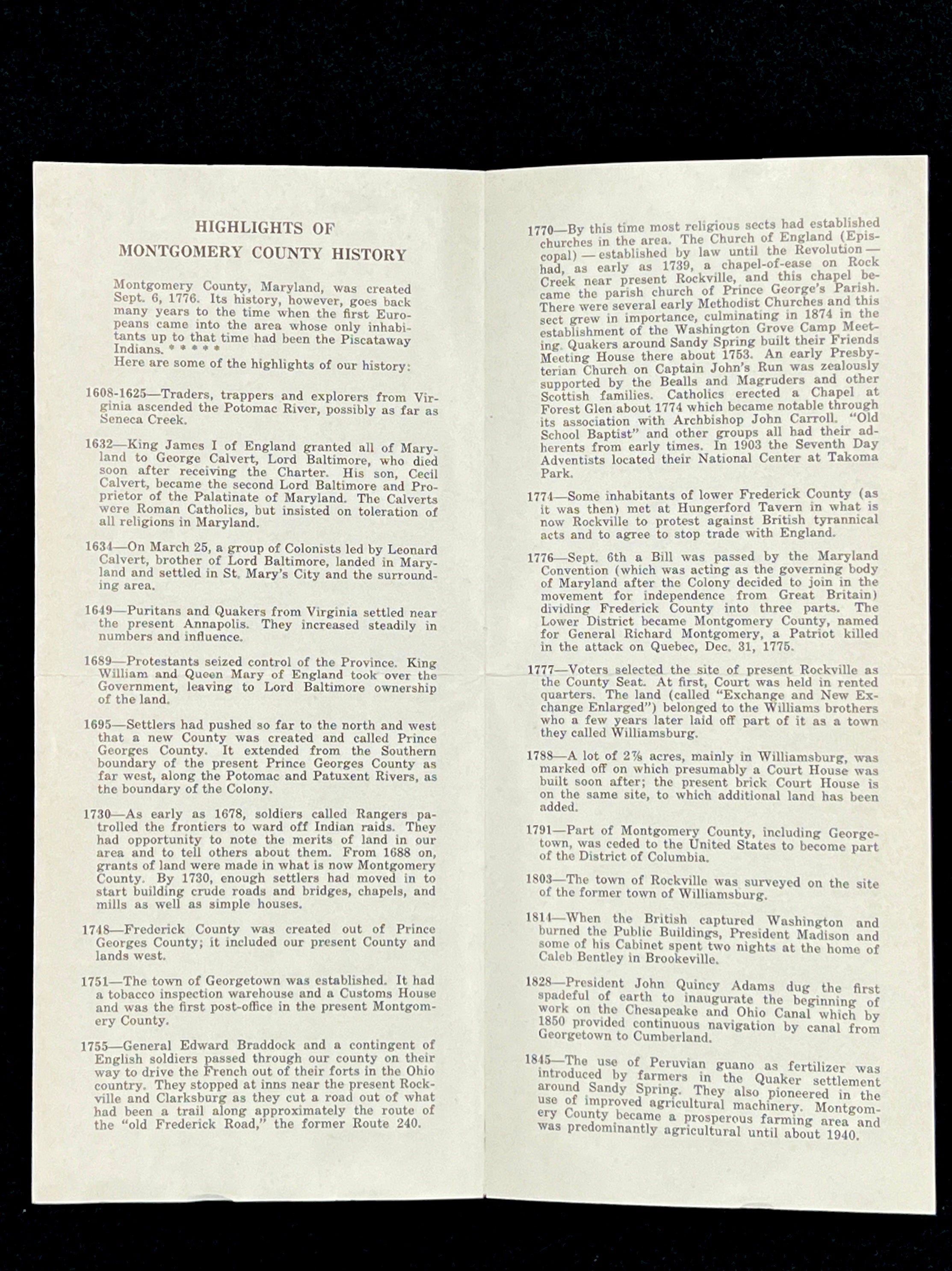 A light blue vintage paper cover of a mid-century Montgomery County Maryland historical publication resting flat on a dark background. - Photo 11