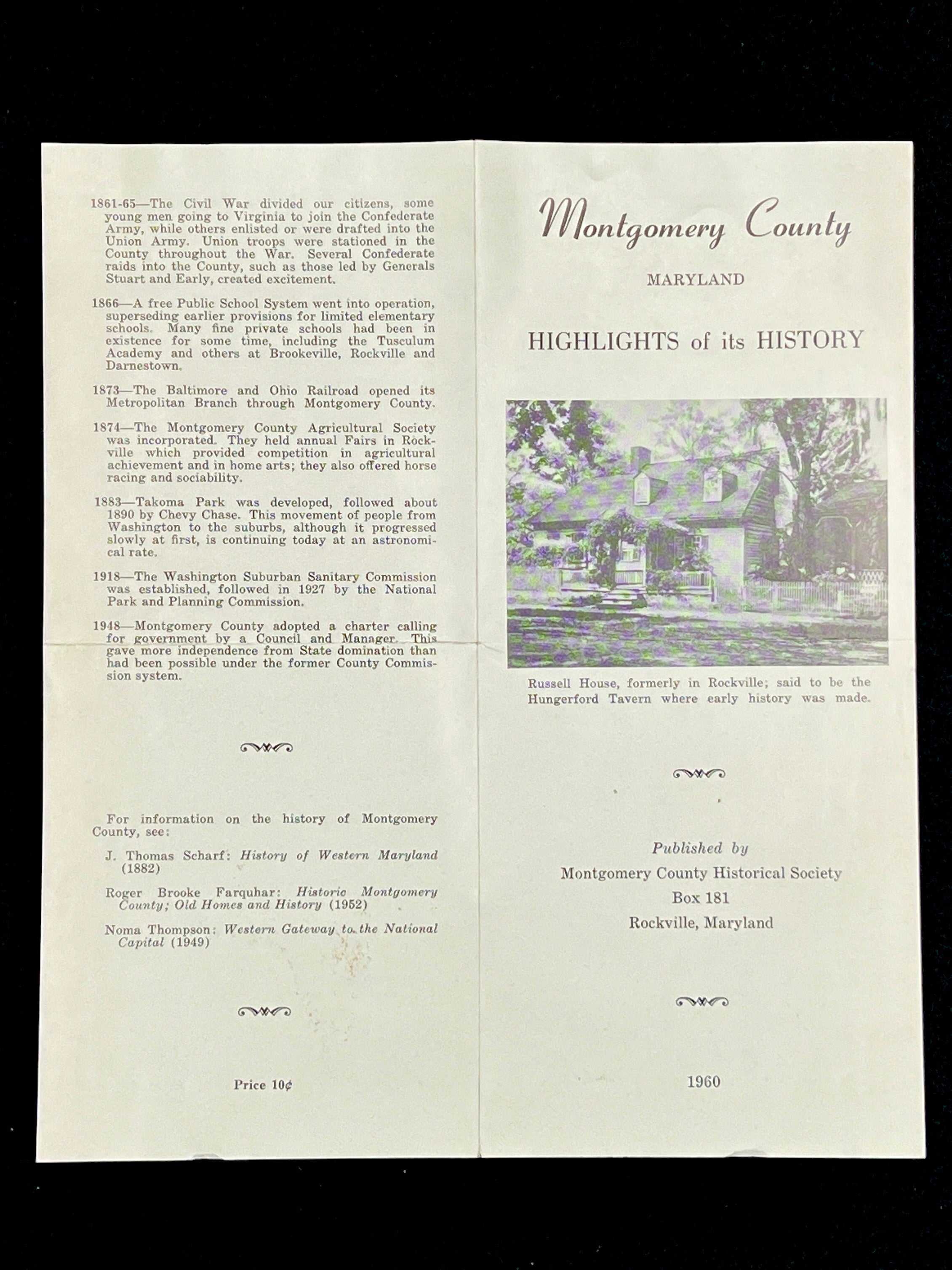 A light blue vintage paper cover of a mid-century Montgomery County Maryland historical publication resting flat on a dark background. - Photo 12