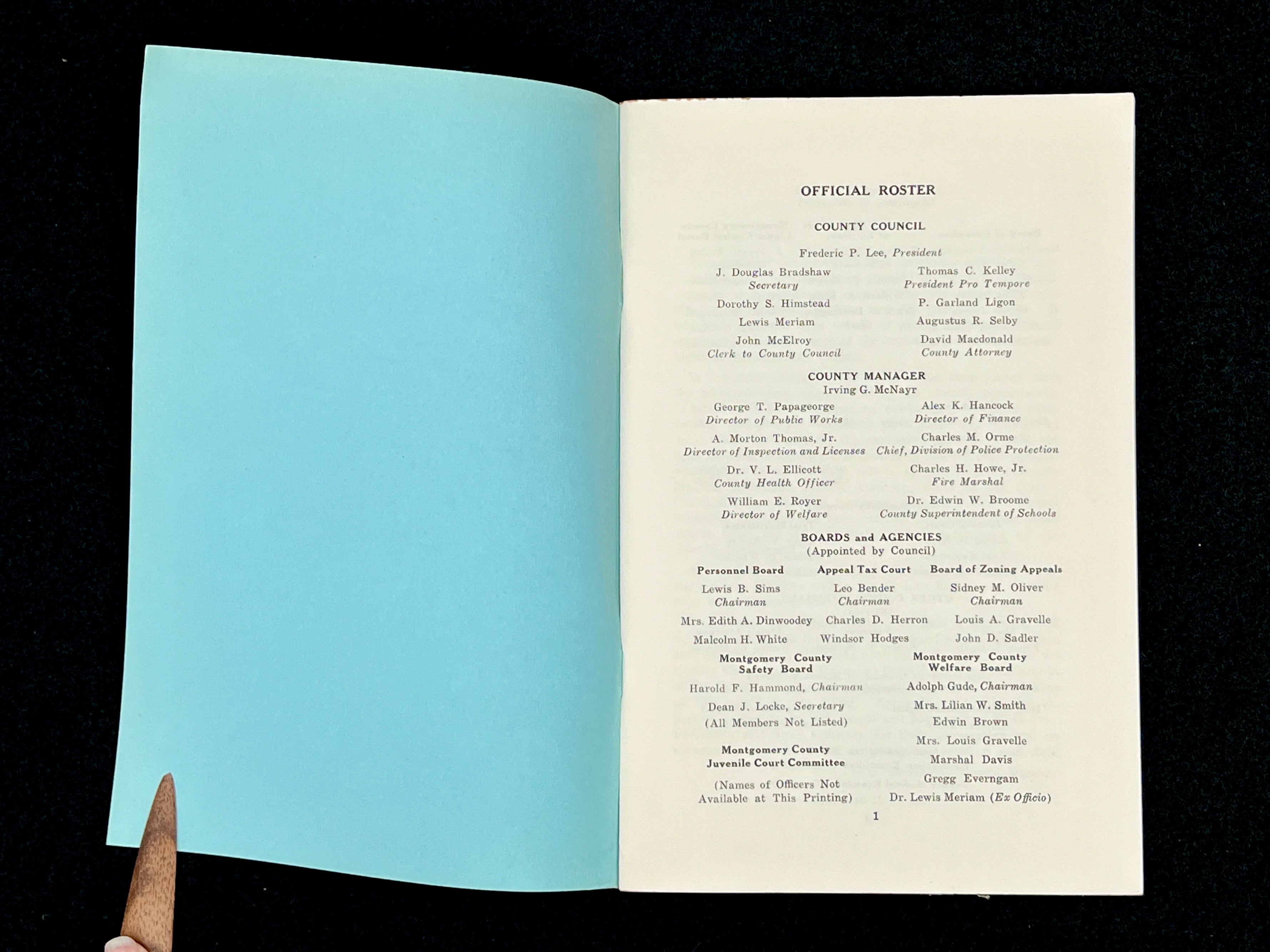 A light blue vintage paper cover of a mid-century Montgomery County Maryland historical publication resting flat on a dark background. - Photo 14