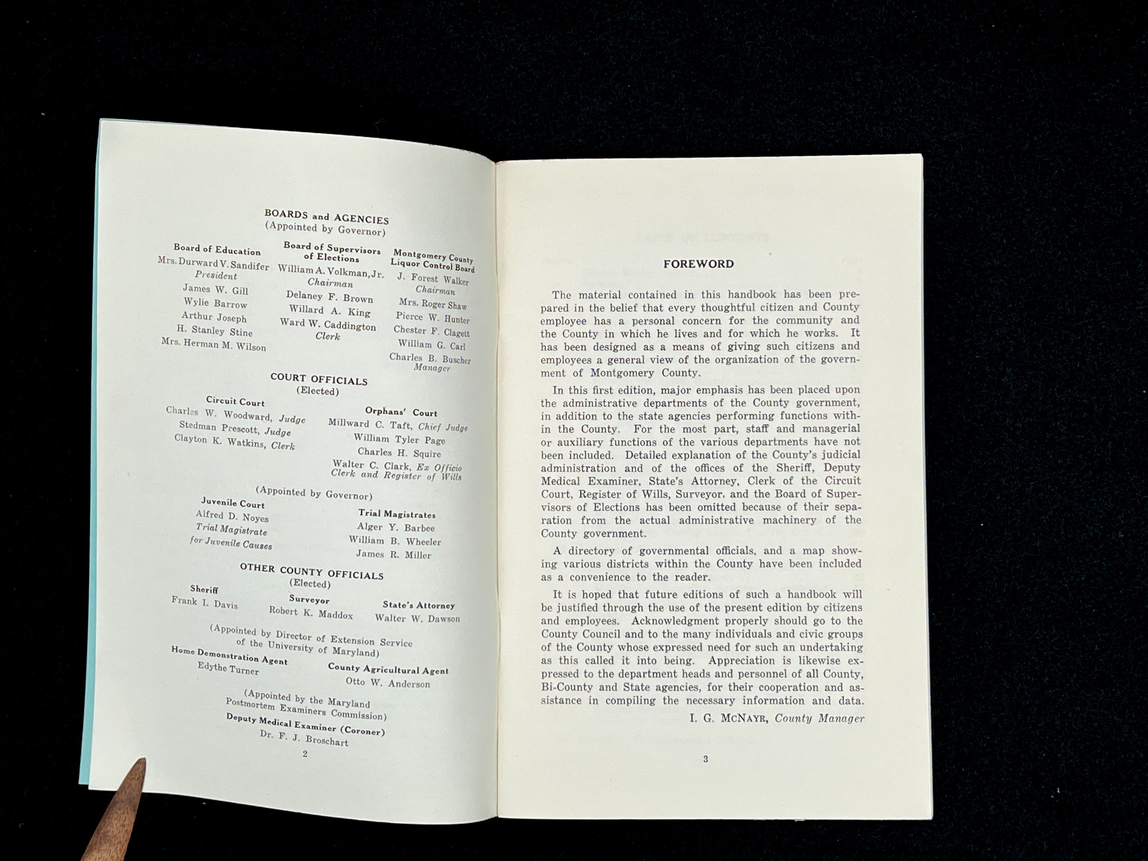 A light blue vintage paper cover of a mid-century Montgomery County Maryland historical publication resting flat on a dark background. - Photo 15