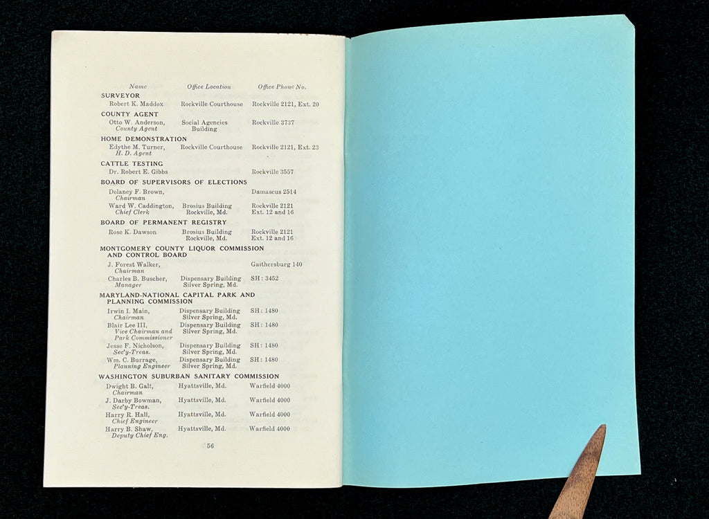 A light blue vintage paper cover of a mid-century Montgomery County Maryland historical publication resting flat on a dark background. - Photo 17