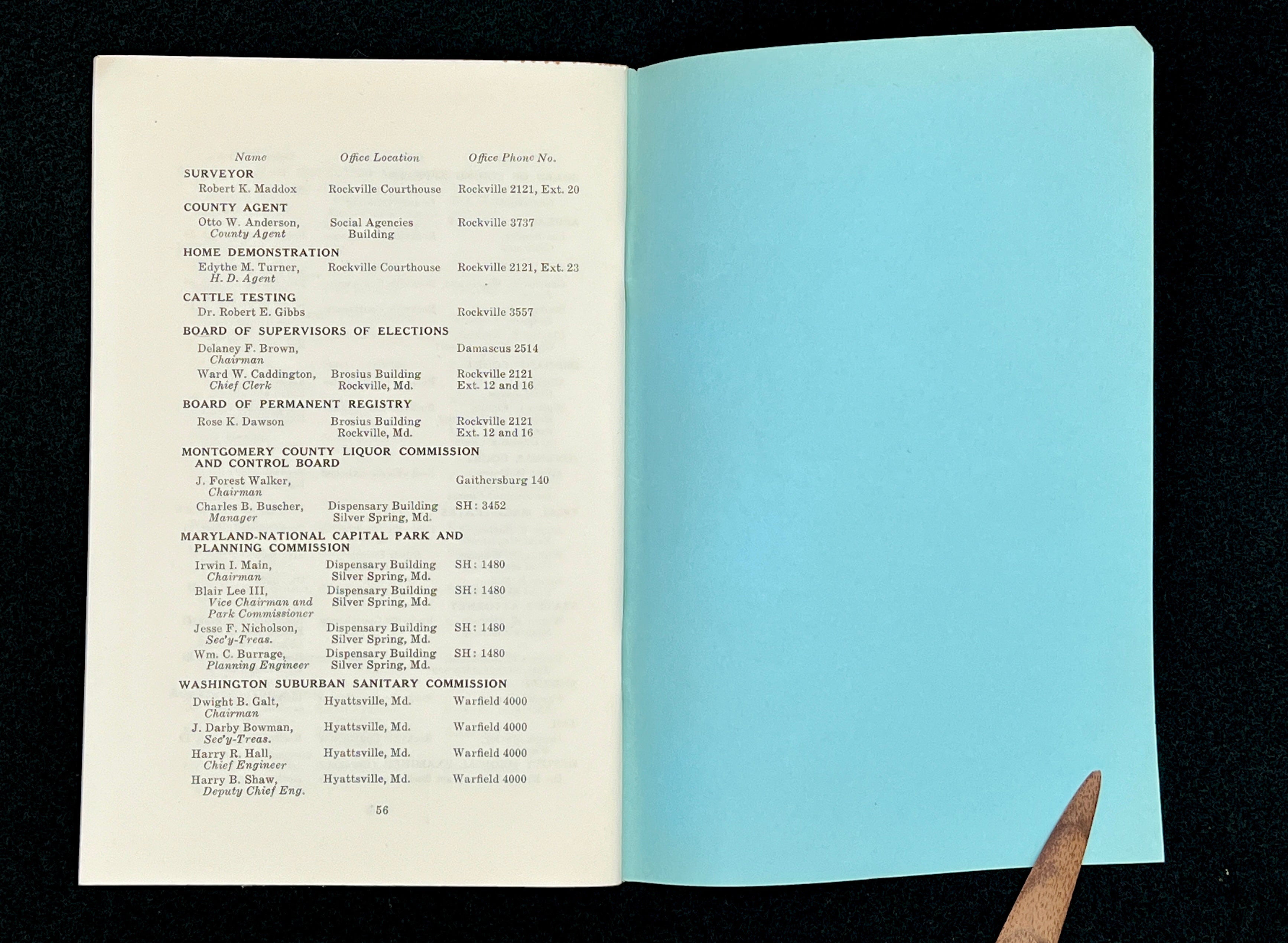 A light blue vintage paper cover of a mid-century Montgomery County Maryland historical publication resting flat on a dark background. - Photo 17