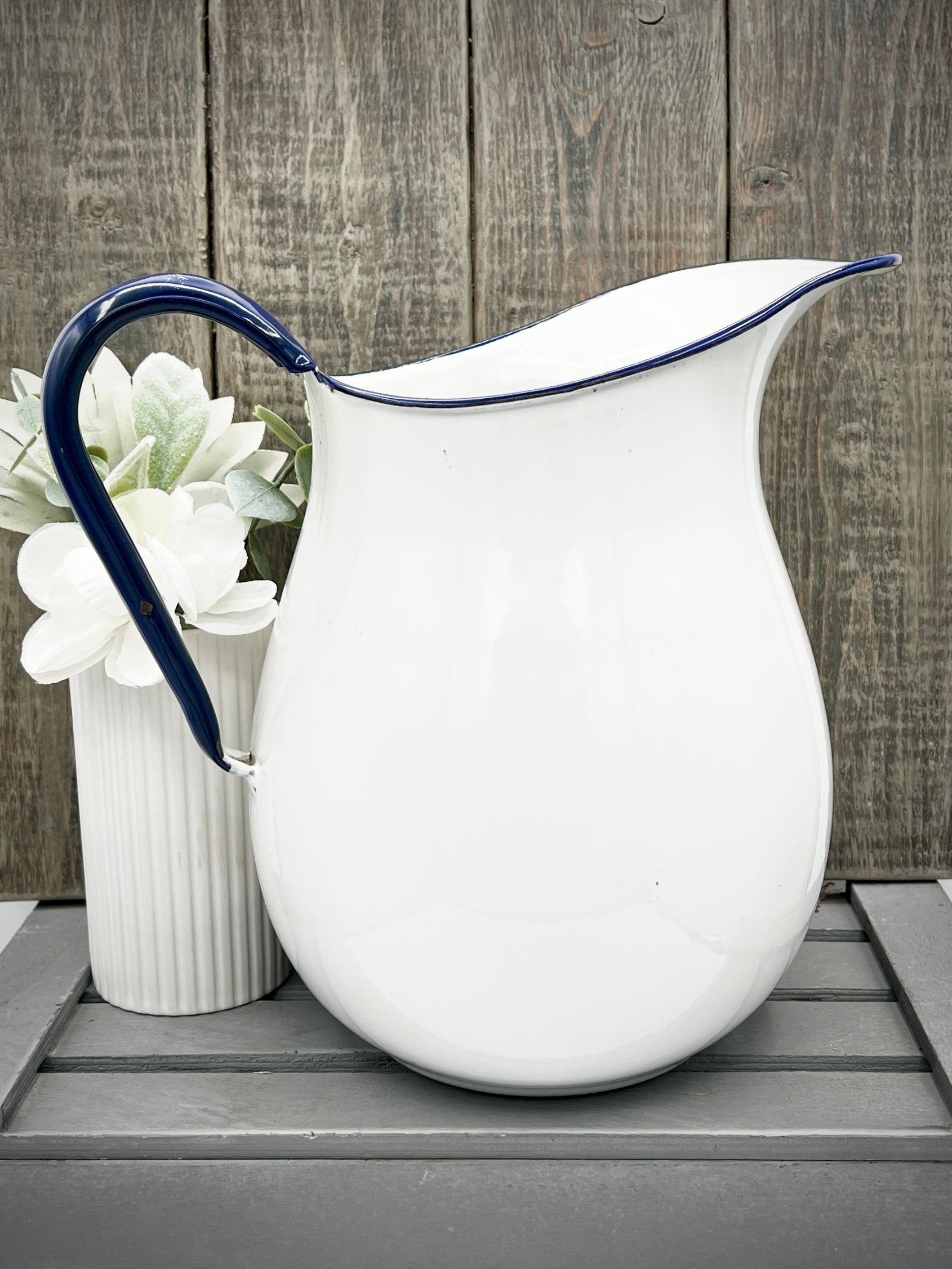 White Enamelware Pitcher w/ Blue Handle