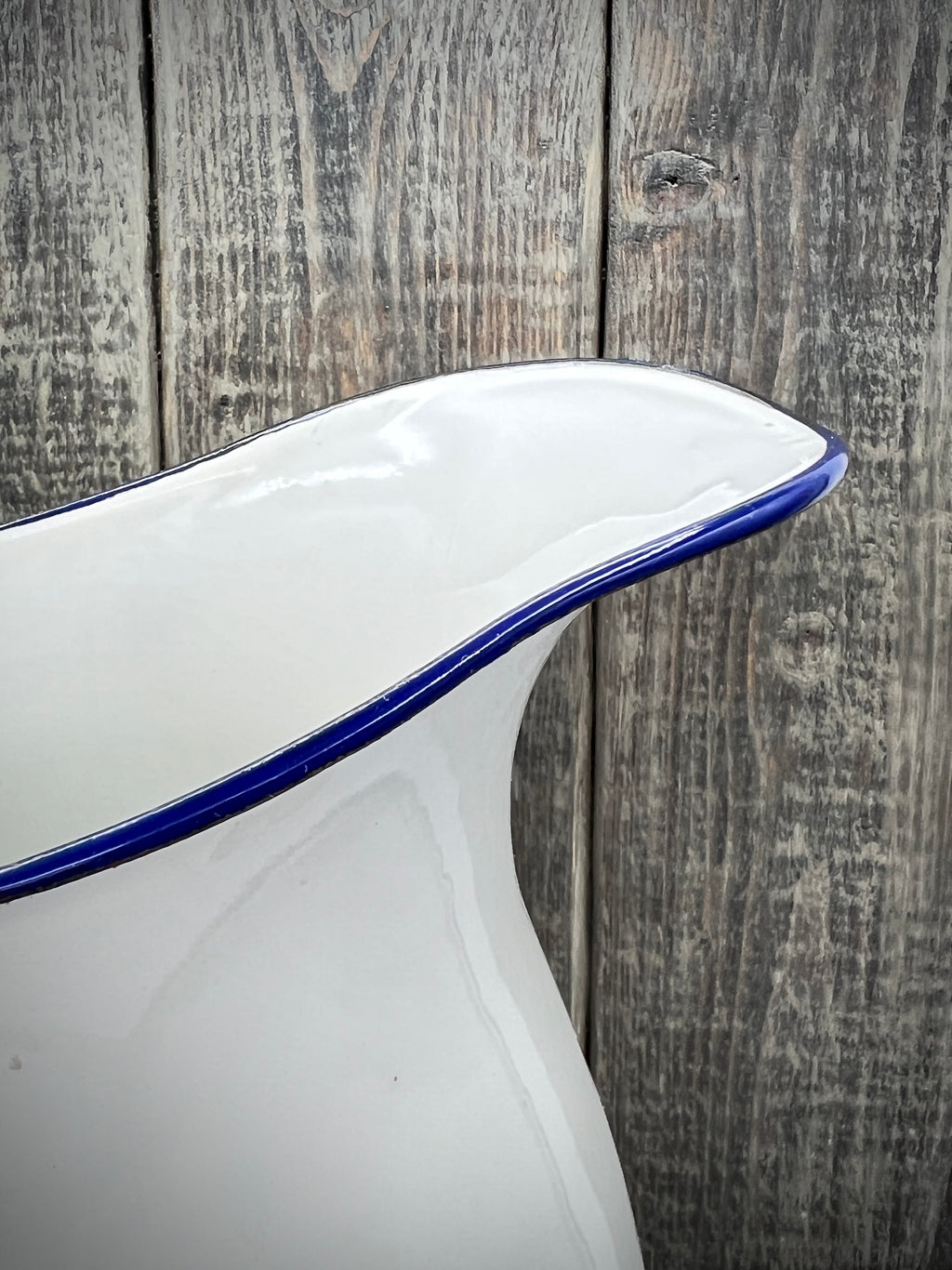White Enamelware Pitcher w/ Blue Handle